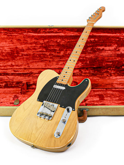 Classic 1982 Fender Telecaster electric guitar displayed in a wooden case, highlighting its vintage appeal.