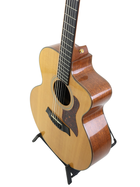 Classic 1995 Taylor LKSM Leo Kottke 12-string acoustic guitar, featuring intricate details and a warm, resonant sound.