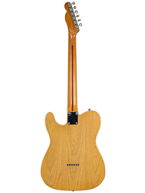 Classic Fender AVRI ‘52 Telecaster guitar, boasting a wooden body and neck, representing vintage craftsmanship from 1982.