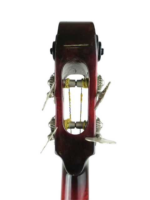 Close-up image of a violin featuring a string, emphasizing its classic design and fine details.