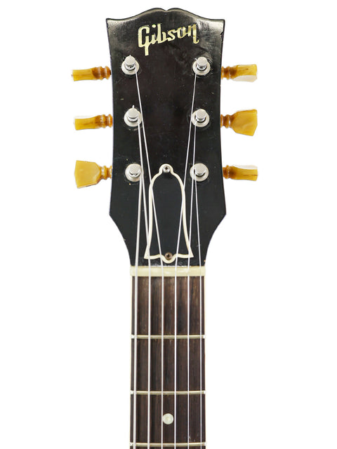 Close-up of a 1959 Vintage Gibson ES-225TD headstock, highlighting its iconic shape and rich heritage in guitar design.