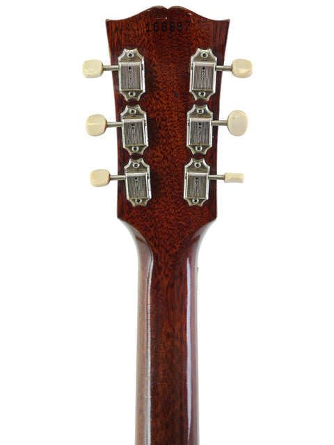 Close-up of a 1964 Vintage Gibson Southern Jumbo guitar neck, highlighting four knobs and intricate craftsmanship.