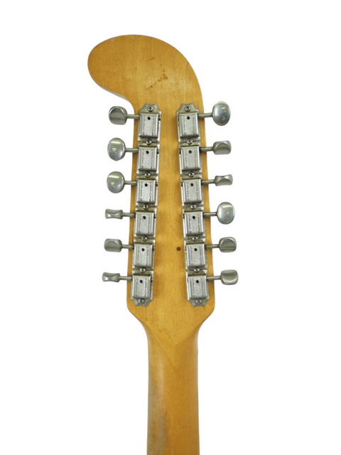 Close-up of a 1965 USA Fender Electric XII guitar head, highlighting its knobs and vintage aesthetic.