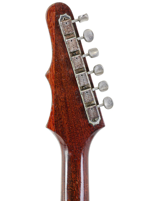 Close-up of a 1966 Epiphone Crestwood Custom headstock, highlighting its vintage charm and wooden body.