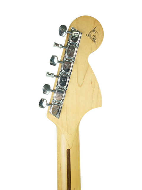 Close-up of a Fender Custom Shop guitar head against a white background, showcasing its unique design and craftsmanship.