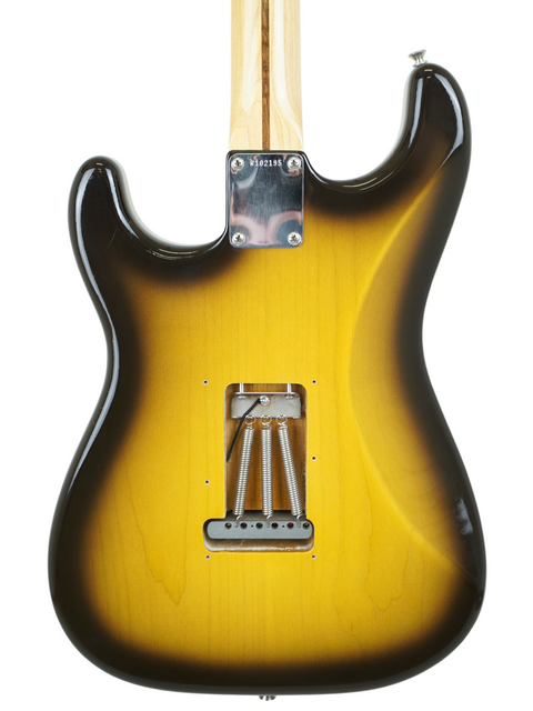 Close-up of a Fender Paul Waller Masterbuilt '56 Stratocaster guitar neck, showcasing its craftsmanship and design details.