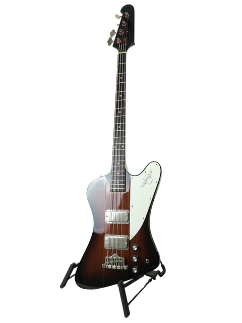 Close-up of a brown guitar featuring a white headstock, identified as the Orville Thunderbird Bass, Tobacco Burst, Japan 1988.