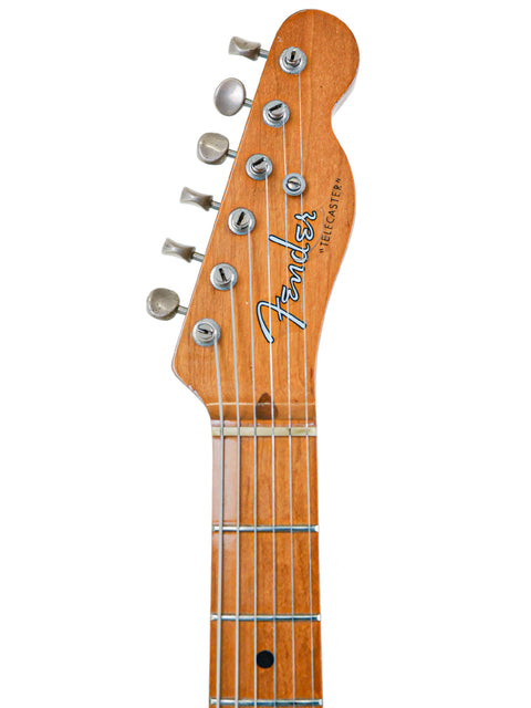 Close-up of a vintage Fender AVRI ‘52 Telecaster, USA-made in 1982, featuring its timeless design and craftsmanship.