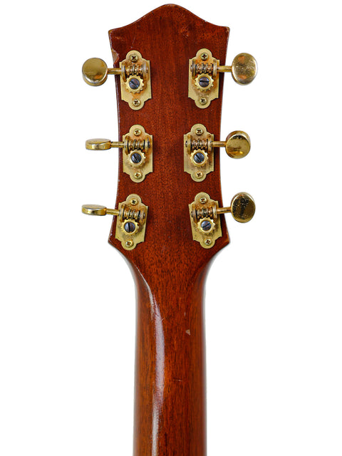 Close-up of the headstock from a 1955 Gretsch 6130 Roundup acoustic guitar, showcasing four tuning knobs.