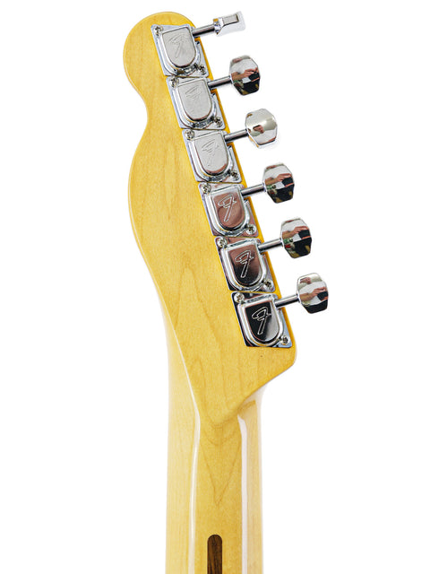 Detailed shot of a guitar neck from a Txxx Custom Thinline '72 Partscaster, showcasing its pickup and B5 Bigsby.