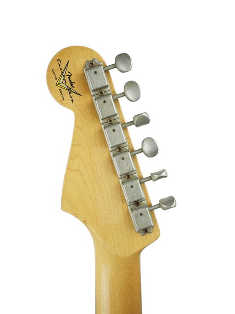 Detailed view of a '64 Stratocaster Relic guitar neck by Fender Custom Shop, set on a white backdrop.