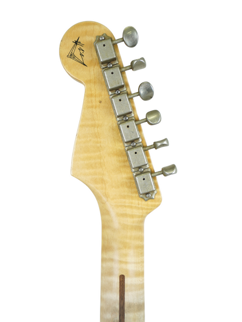 Detailed view of a Fender Kyle McMillin Masterbuilt '57 Stratocaster guitar head on a clean white backdrop.