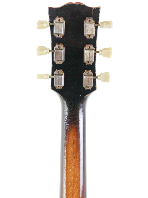 Detailed view of the headstock from a 1946 Gibson ES-300 guitar, highlighting its vintage charm and iconic features.