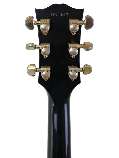 Detailed view of the headstock from a 2008 Gibson Custom Jimmy Page Les Paul Custom, highlighting its unique features.