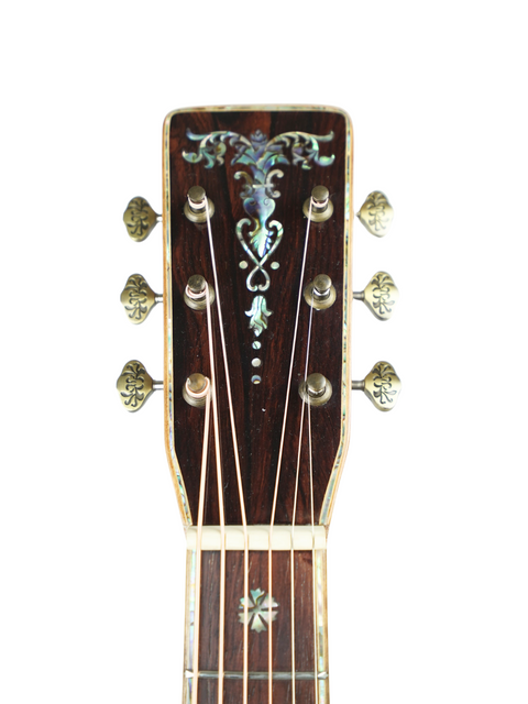 Detailed view of the headstock on a Philson Custom D-18 Style Cocobolo acoustic guitar, highlighting its craftsmanship.