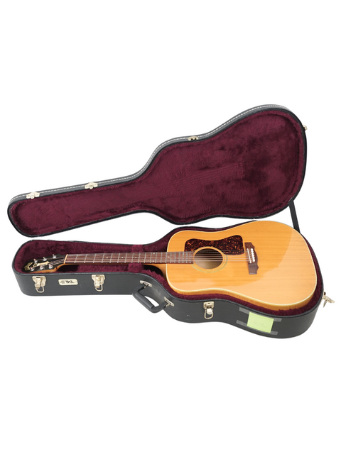 Discover the charm of a 1987 Guild D030A07 Dreadnought guitar safely stored in a beautiful wooden case, ideal for any guitarist.