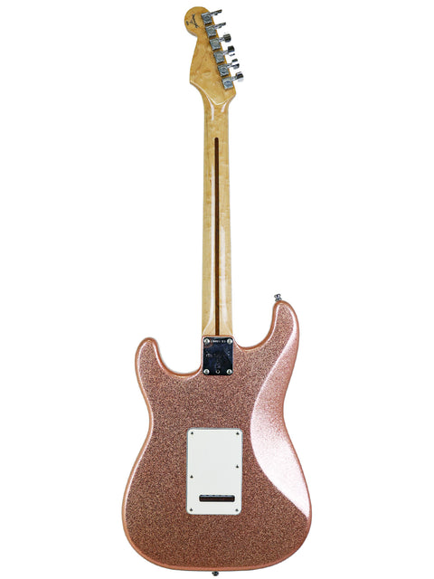 Elegant rose gold Fender Stratocaster, a 1994 Custom Shop American Classic model, exemplifying premium craftsmanship and style.