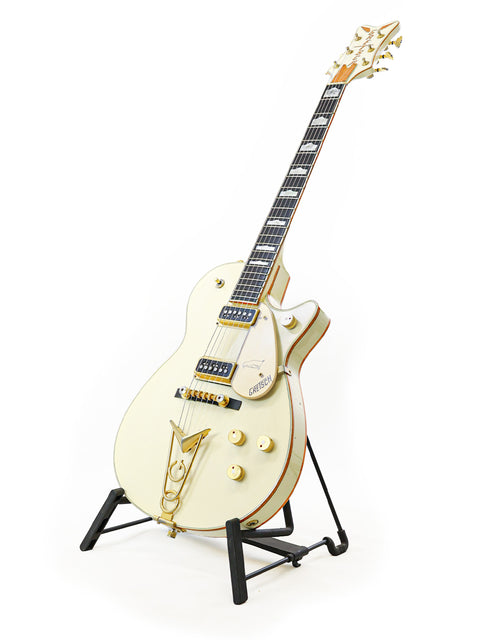 Exquisite 1994 Gretsch 6134 White Penguin guitar featuring gold hardware, showcased on a stand, ideal for any music lover.