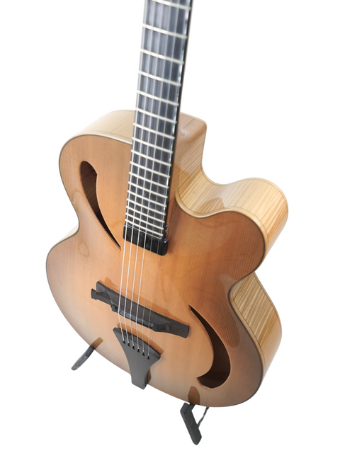 Exquisite Hancock Phantom Custom Archtop guitar showcasing a wooden body and stylish black pick guard, a must-have for guitar lovers.
