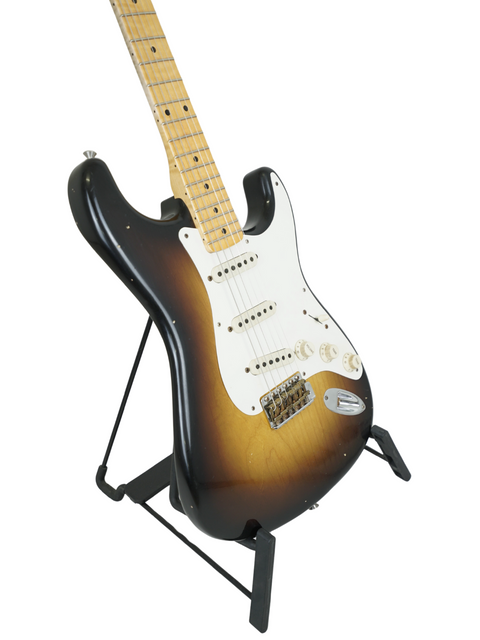 Fender '57 Stratocaster by Kyle McMillin displayed on a stand with a bright white backdrop.