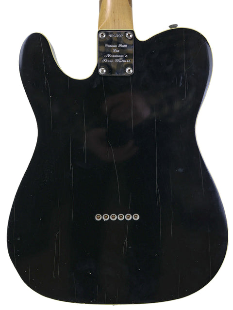 Fender '59 Custom Telecaster in black, with a wooden body and neck, exemplifying the artistry of the 2006 NRG Special Release.