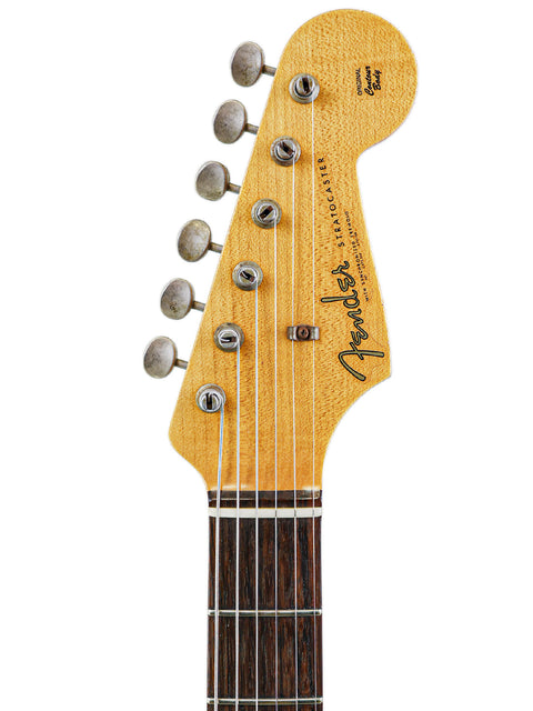 Fender Custom Shop '62 Stratocaster Relic featured on a white background, illustrating its timeless design and vintage appeal.