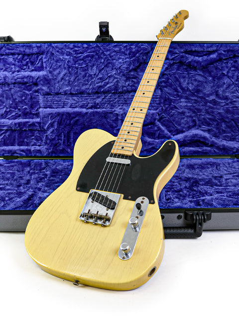 Fender Custom Shop 70th Anniversary Broadcaster guitar securely housed in a case, set on a white backdrop.