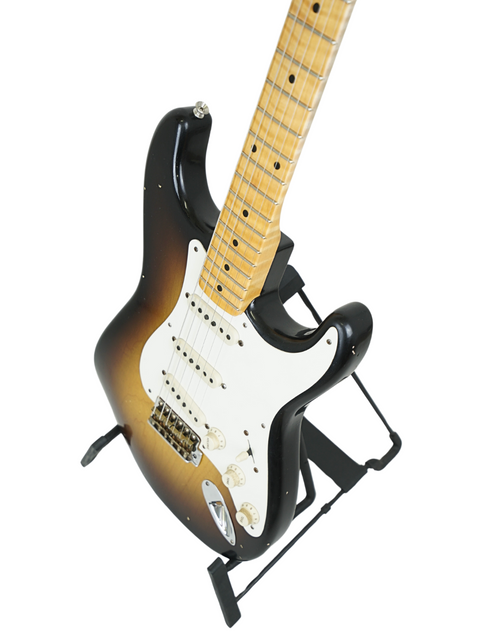 Fender Kyle McMillin Masterbuilt '57 Stratocaster in black with a white pickguard, highlighting its classic style and craftsmanship.