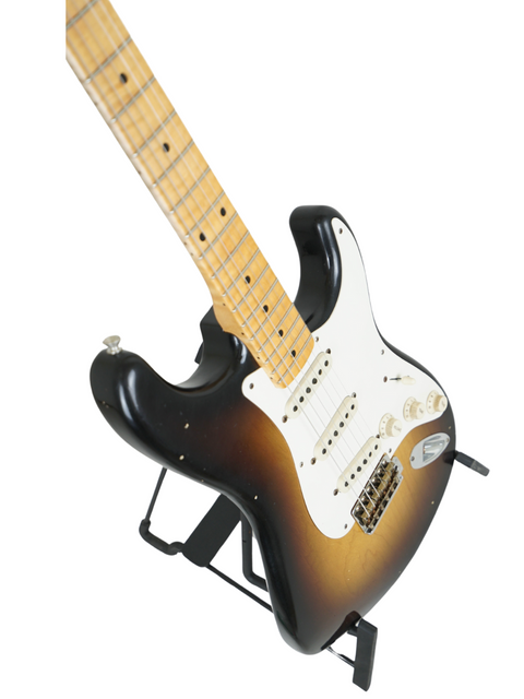 Fender Kyle McMillin Masterbuilt '57 Stratocaster on a stand, set against a clean white background, from USA 2022.