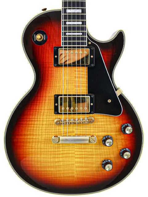 Gibson Custom Shop '68 Reissue Les Paul Custom guitar featuring a vibrant sunburst finish, crafted in the USA in 2006.