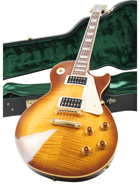 Gibson Jimmy Page Signature Les Paul Standard guitar in honeyburst, displayed with a green case, perfect for collectors and musicians.