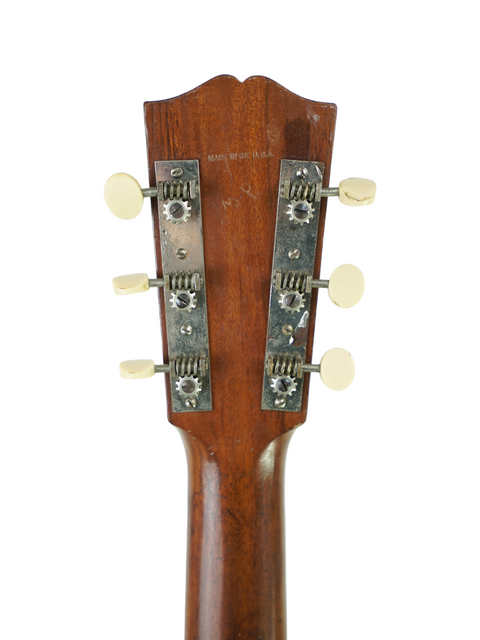 Headstock of a 1929 Vintage Gibson L-0 acoustic guitar, highlighting its classic design and historical significance.