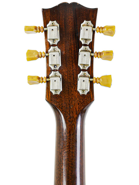 Headstock of a 1959 Vintage Gibson ES-225TD acoustic guitar, displaying four knobs that enhance its vintage appeal.
