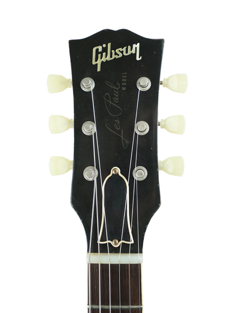 Headstock of a 2007 Gibson Les Paul '59 Reissue, showcasing the iconic design and luxurious Brazilian board craftsmanship.