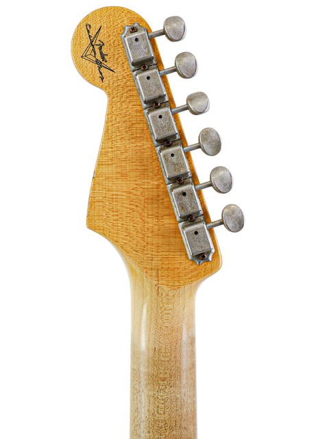 Image of a guitar neck with a wooden headstock, highlighting the Fender Custom Shop '62 Stratocaster Relic from 2009.