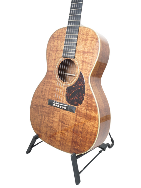 Martin Luther King Jr.'s acoustic guitar, a Martin 000-28K Authentic 1921, showcased in a peaceful environment.