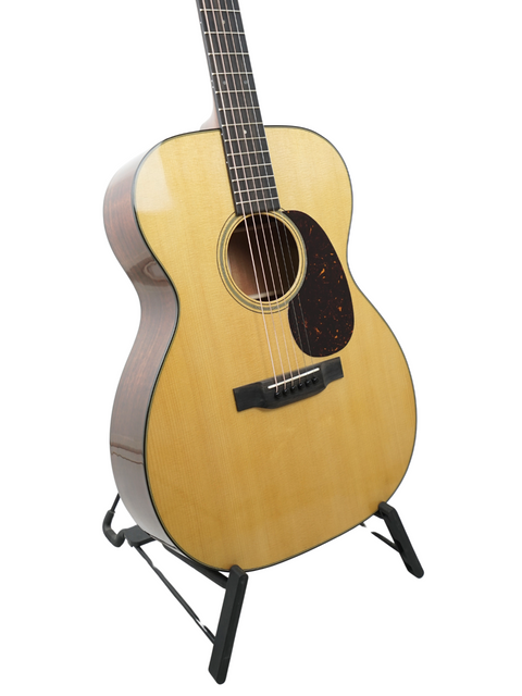 Martin Luther King Jr. strumming a Martin 000-18 acoustic guitar, showcasing the harmony of music and social change.