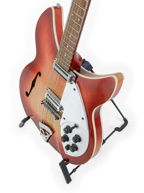 Rickenbacker 12-string guitar with a striking white body and red neck, vintage model from 1993 Rose Morris, USA 1965.