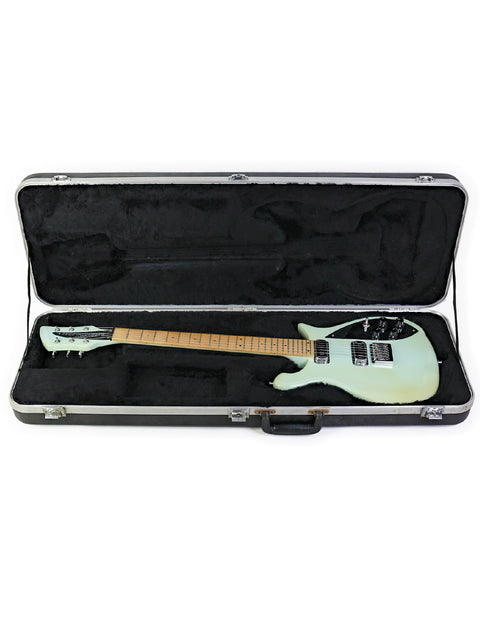 Rickenbacker 650C Colorado guitar in a case, showcasing its vibrant green color, crafted in the USA in 2005.