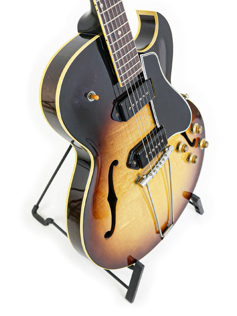 Stunning 1959 Vintage Gibson ES-225TD guitar with a black body and eye-catching sunburst finish, a true American classic.