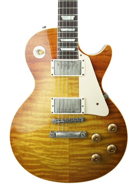 Stunning Gibson Les Paul '59 Reissue in sunburst finish, featuring a Brazilian board, perfect for collectors and musicians alike.