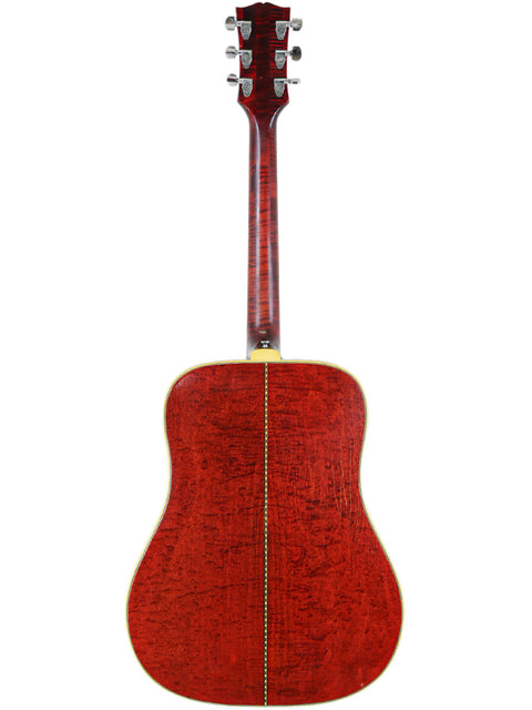 Stunning red finish on the back of a vintage 1968 Gibson Dove acoustic guitar, a true classic from the USA.