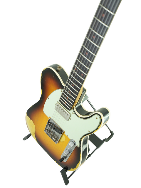 Sunburst-finished Fender Custom Shop 60s Telecaster on a stand, highlighting its vintage relic features from 2017.