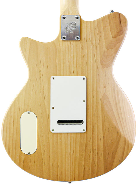 The Koll Troubadour electric guitar, USA 2013, displays a wooden body and a white pickup, highlighting its elegant craftsmanship.