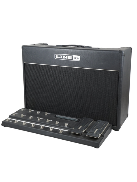 The black and white Line-6 Vetta II guitar amplifier from 2004, elegantly placed on a cabinet, emphasizing its classic look.
