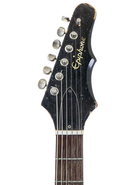 The headstock of a 1966 Epiphone Crestwood Custom guitar, featuring its unique vintage design and iconic brand logo.