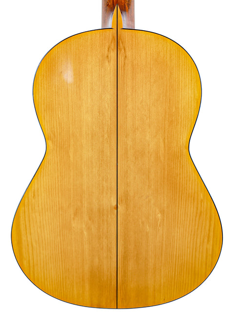 The wooden back of a 1963 José Ramírez 2A acoustic guitar, highlighting its classic design and fine Spanish craftsmanship.