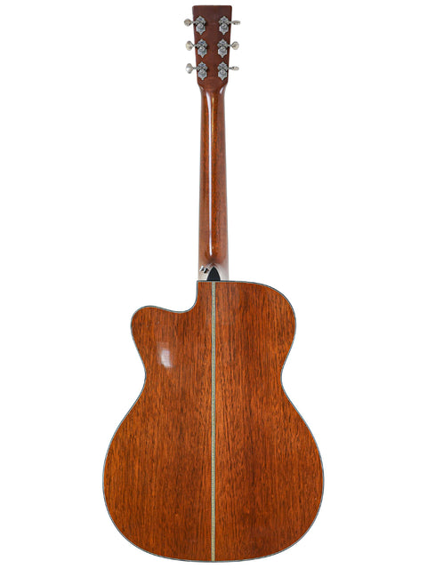 The wooden back of a Martin 000-C David Gray Custom acoustic guitar, highlighting its craftsmanship and design from 2004.