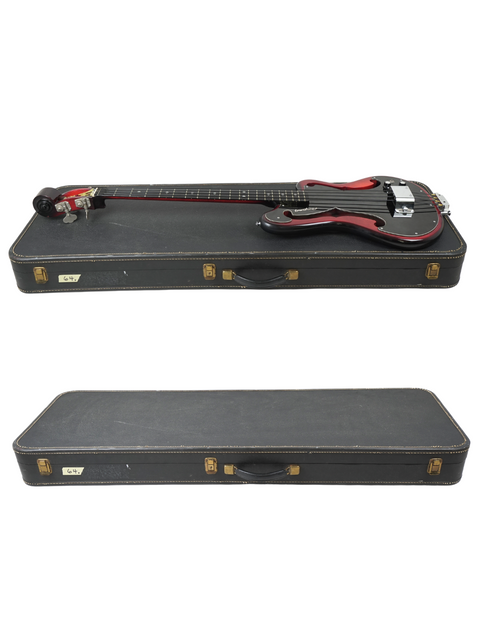 Two bass guitars on a black case, featuring the classic 1966 Vintage Ampeg AEB-1 Horizontal Electric Bass.