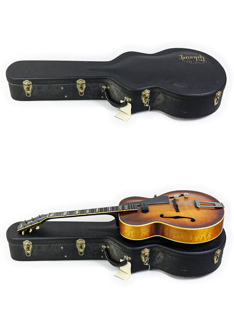 Two guitars, one a 1946 Gibson ES-300, elegantly placed in their cases on a bright white surface.